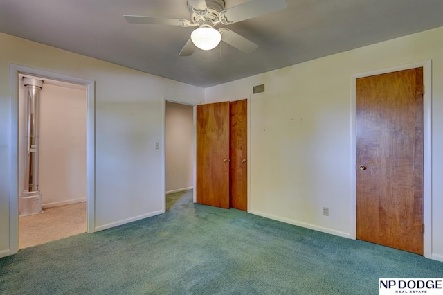 2352 Lincoln St, Blair, NE 68008 - unfurnished bedroom featuring carpet floors, two closets, baseboards, and ceiling fan