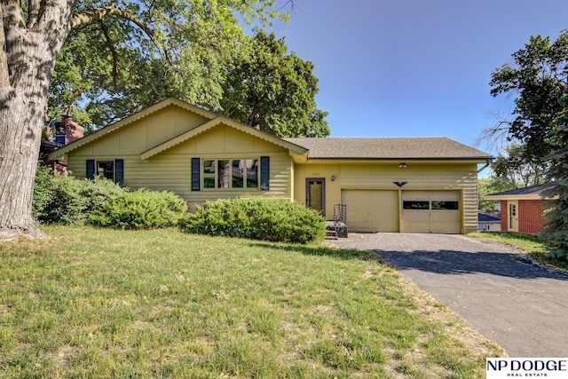 2352 Lincoln St, Blair, NE 68008 - view of front of house featuring driveway, an attached garage, and a front yard