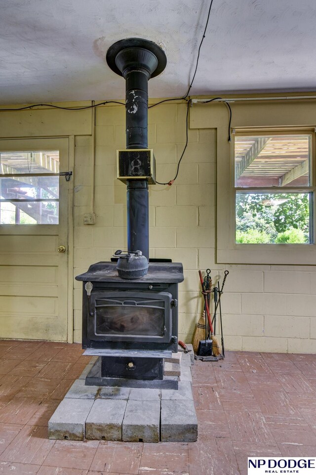 2352 Lincoln St, Blair, NE 68008 - detailed view of a wood stove and concrete block wall