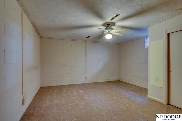 2352 Lincoln St, Blair, NE 68008 - unfurnished room featuring a textured ceiling, ceiling fan, and concrete block wall