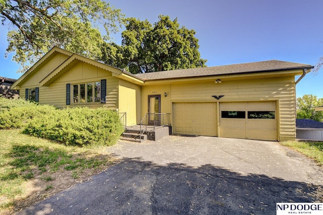 2352 Lincoln St, Blair, NE 68008 - view of front of property with an attached garage and asphalt driveway