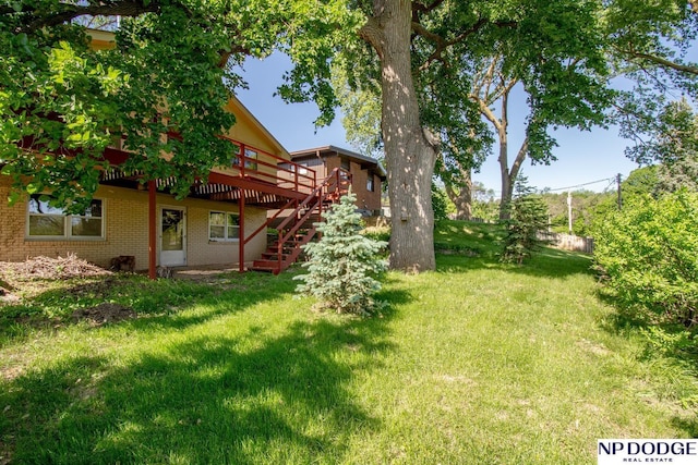 2352 Lincoln St, Blair, NE 68008 - view of grassy yard featuring a deck and stairway