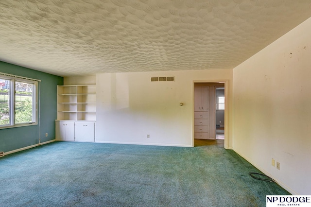 2352 Lincoln St, Blair, NE 68008 - carpeted spare room featuring baseboards and a textured ceiling