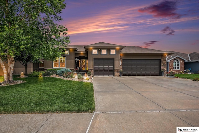 2705 N 189th St, Omaha, NE 68022 - view of front of home with an attached garage, a lawn, driveway, stucco siding, and stone siding