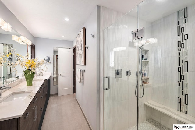 2705 N 189th St, Omaha, NE 68022 - bathroom featuring vanity, a stall shower, recessed lighting, and baseboards