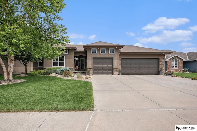2705 N 189th St, Omaha, NE 68022 - view of front of home with an attached garage, a front yard, driveway, stucco siding, and stone siding