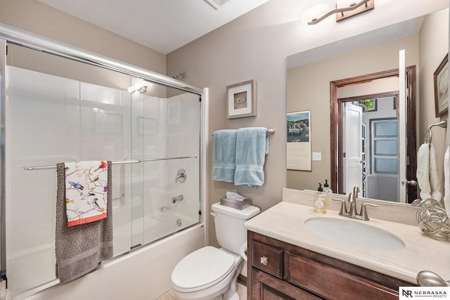 2705 N 189th St, Omaha, NE 68022 - bathroom with toilet, shower / bath combination with glass door, and vanity