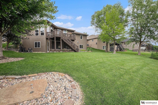 2705 N 189th St, Omaha, NE 68022 - view of green lawn featuring stairway and a wooden deck
