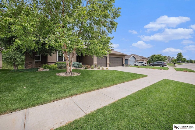 2705 N 189th St, Omaha, NE 68022 - view of front facade with concrete driveway, an attached garage, a front lawn, and stone siding