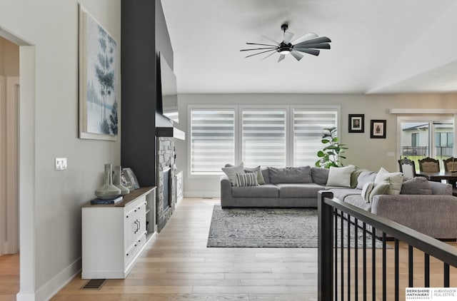 5508 N 208th St, Elkhorn, NE 68022 - living area featuring a ceiling fan, healthy amount of natural light, light wood-style flooring, and baseboards