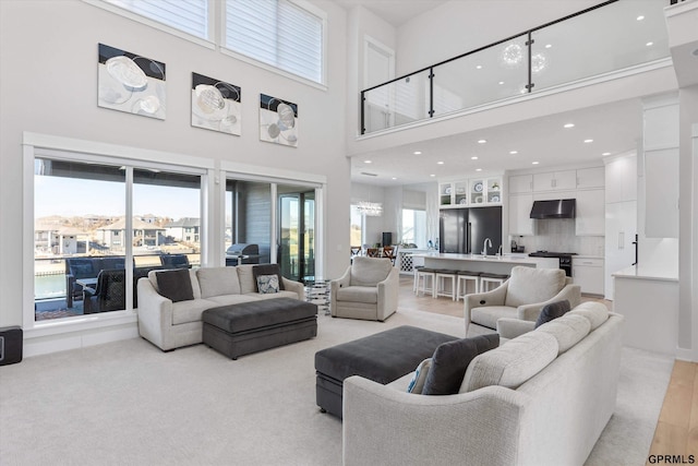 12604 N 178th Cir, Bennington, NE 68007 - living room with light carpet, a high ceiling, and recessed lighting