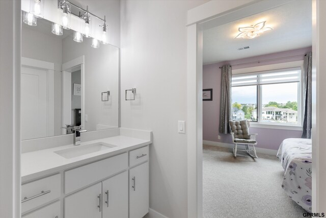 12604 N 178th Cir, Bennington, NE 68007 - bathroom featuring baseboards, vanity, and ensuite bathroom