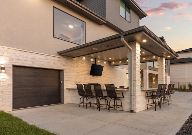 12604 N 178th Cir, Bennington, NE 68007 - view of patio / terrace with an attached garage