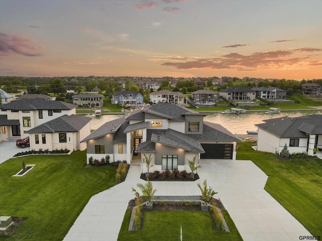 12604 N 178th Cir, Bennington, NE 68007 - view of front facade with concrete driveway, a residential view, a front lawn, a water view, and a shingled roof