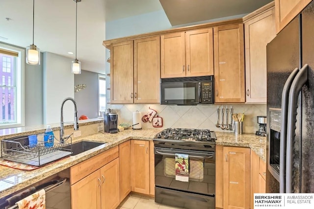 210 S 16th St S Unit 918, Omaha, NE 68102 - kitchen featuring black appliances, backsplash, a sink, and light stone countertops