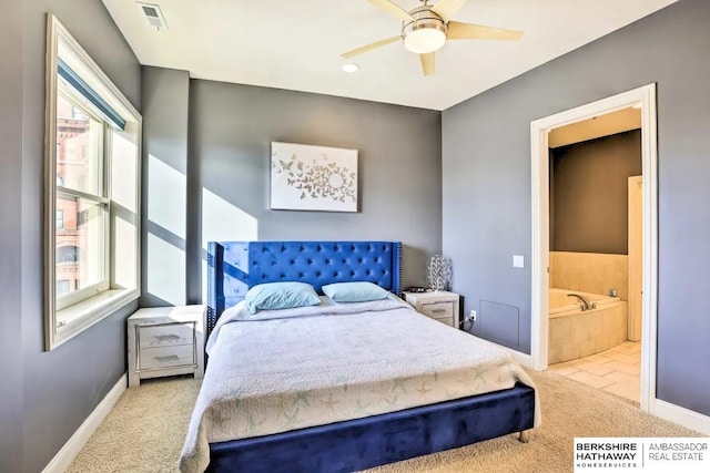 210 S 16th St S Unit 918, Omaha, NE 68102 - carpeted bedroom featuring baseboards, ensuite bath, recessed lighting, and ceiling fan