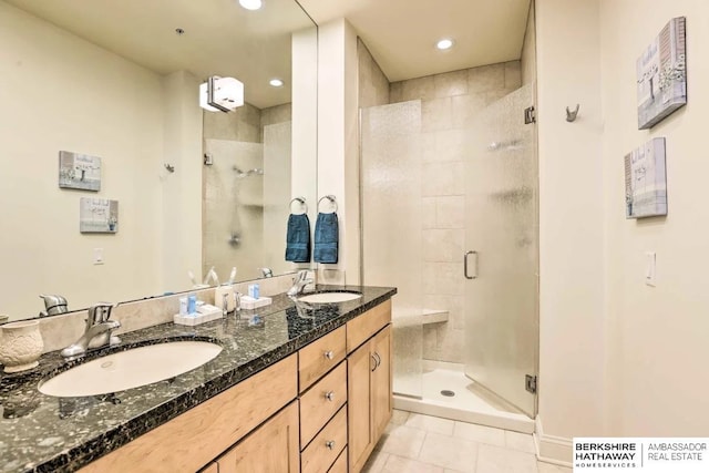 210 S 16th St S Unit 918, Omaha, NE 68102 - bathroom featuring a stall shower, double vanity, tile patterned flooring, and recessed lighting