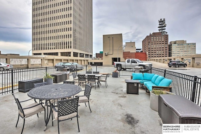 210 S 16th St S Unit 918, Omaha, NE 68102 - view of patio featuring an outdoor hangout area, outdoor dining space, and a view of city
