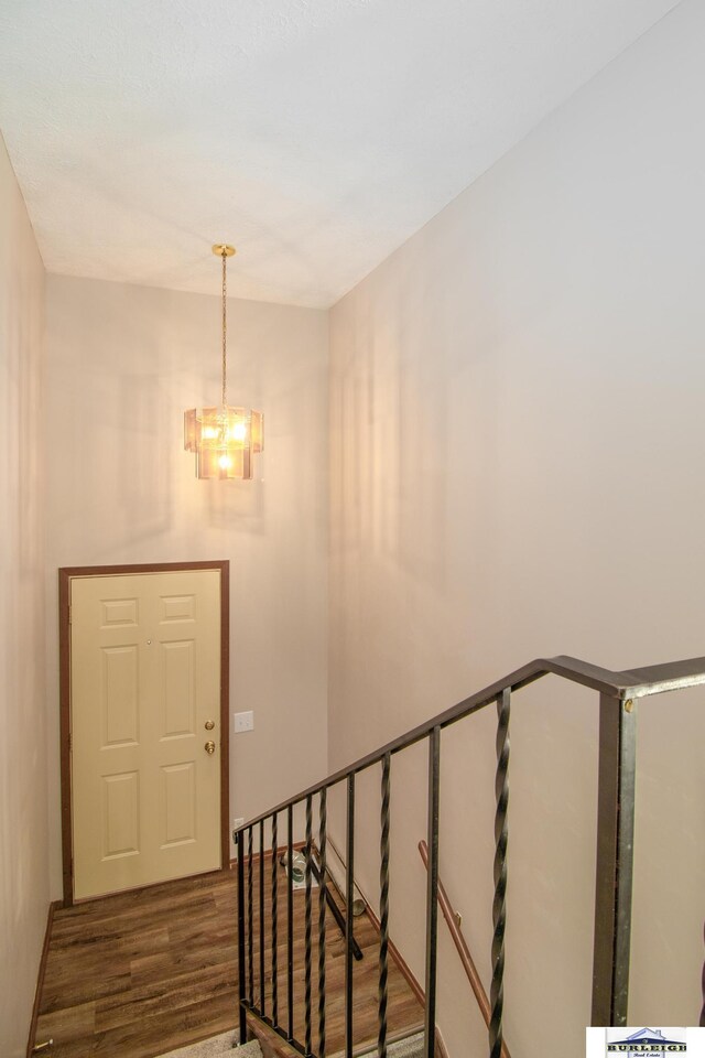 4319 Abbott Rd, Lincoln, NE 68516 - stairway with wood finished floors and a chandelier