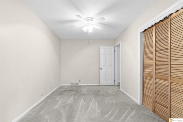 14618 Holmes St, Omaha, NE 68137 - unfurnished bedroom with light colored carpet, a closet, baseboards, and ceiling fan