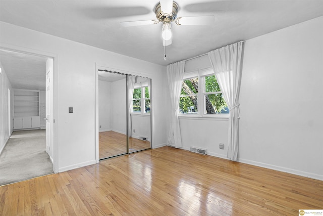 14618 Holmes St, Omaha, NE 68137 - unfurnished bedroom featuring light wood-style flooring, baseboards, and ceiling fan