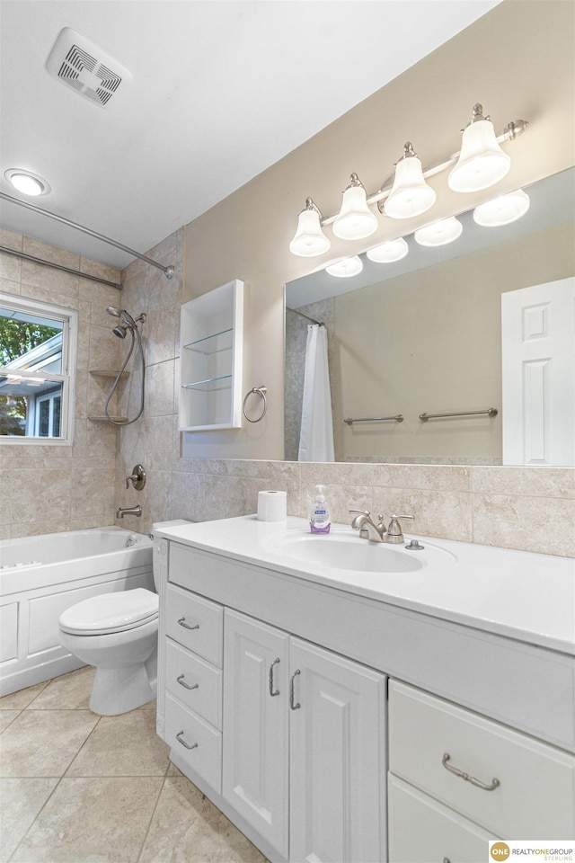 14618 Holmes St, Omaha, NE 68137 - full bath with toilet, tile patterned flooring, vanity, shower / bath combo with shower curtain, and tile walls