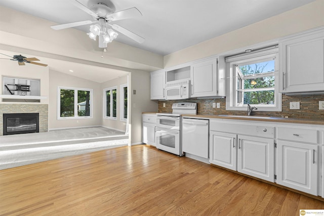 14618 Holmes St, Omaha, NE 68137 - kitchen featuring white appliances, a sink, lofted ceiling, backsplash, and light wood-style flooring