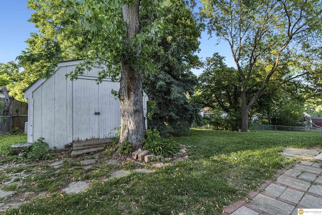 14618 Holmes St, Omaha, NE 68137 - view of yard with a storage unit and an outdoor structure