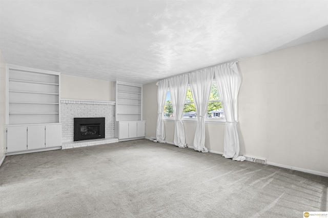 14618 Holmes St, Omaha, NE 68137 - unfurnished living room featuring carpet, a brick fireplace, baseboards, and built in features
