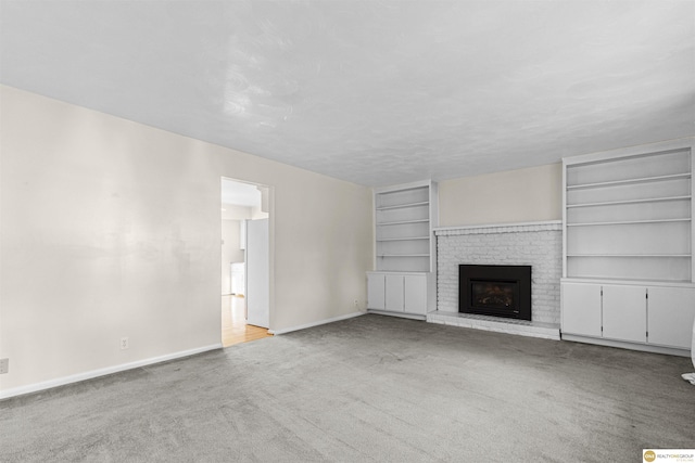 14618 Holmes St, Omaha, NE 68137 - unfurnished living room featuring carpet flooring, baseboards, a brick fireplace, and built in features