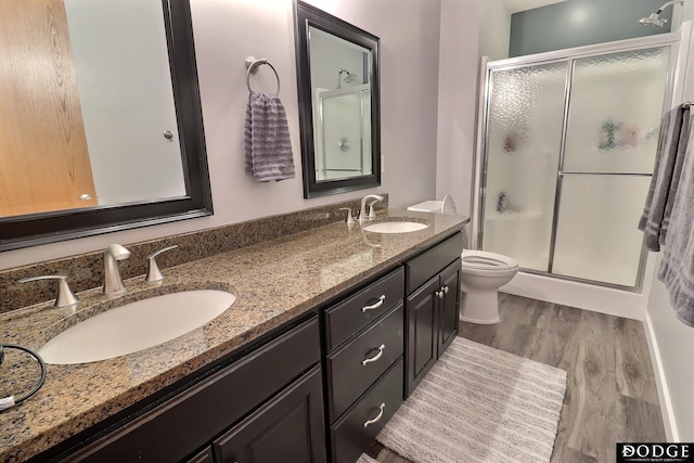 19523 Binney Cir, Elkhorn, NE 68022 - full bath with a shower stall, double vanity, wood finished floors, and toilet