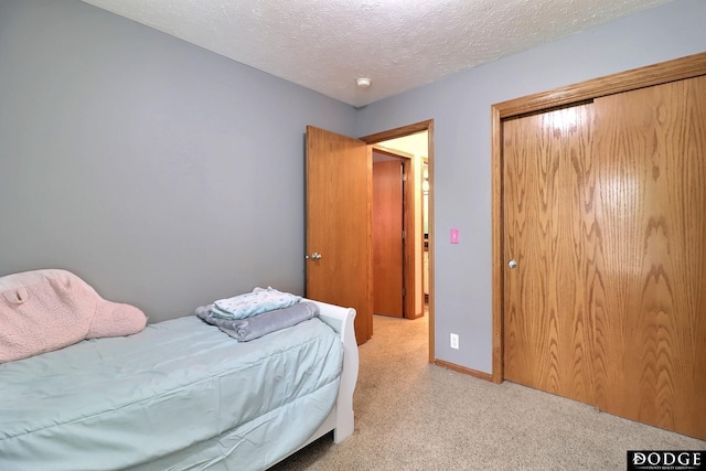 19523 Binney Cir, Elkhorn, NE 68022 - carpeted bedroom with a closet and a textured ceiling