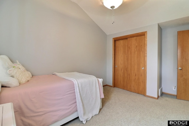 19523 Binney Cir, Elkhorn, NE 68022 - bedroom with lofted ceiling, light colored carpet, baseboards, and a closet