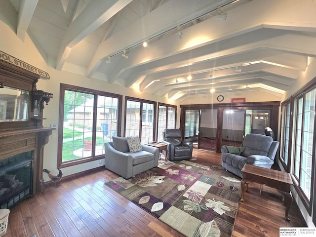 1924 W 8th Ave, Plattsmouth, NE 68048 - living area with track lighting, a fireplace, hardwood / wood-style flooring, and baseboards