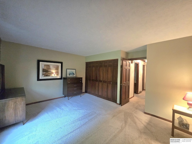 1924 W 8th Ave, Plattsmouth, NE 68048 - bedroom featuring light colored carpet, baseboards, and a closet