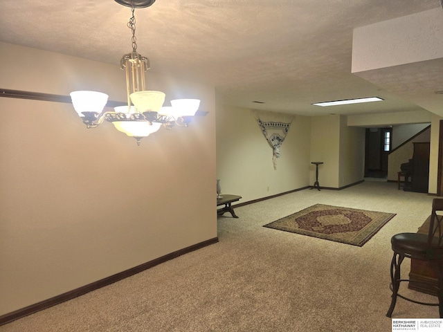 1924 W 8th Ave, Plattsmouth, NE 68048 - finished below grade area with carpet, a textured ceiling, and baseboards