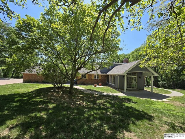1924 W 8th Ave, Plattsmouth, NE 68048 - view of grassy yard with a patio
