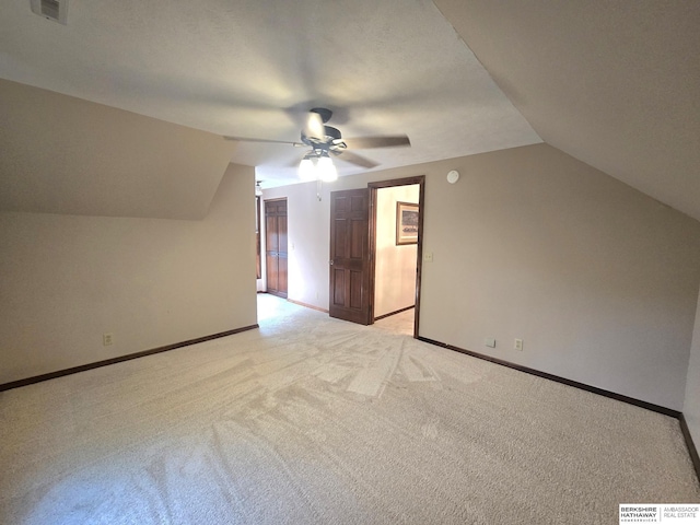 1924 W 8th Ave, Plattsmouth, NE 68048 - additional living space with lofted ceiling, a ceiling fan, light colored carpet, and baseboards