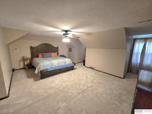 1924 W 8th Ave, Plattsmouth, NE 68048 - carpeted bedroom featuring lofted ceiling, baseboards, ceiling fan, and a textured ceiling