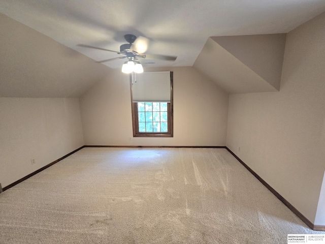 1924 W 8th Ave, Plattsmouth, NE 68048 - additional living space featuring a ceiling fan, carpet flooring, baseboards, and vaulted ceiling