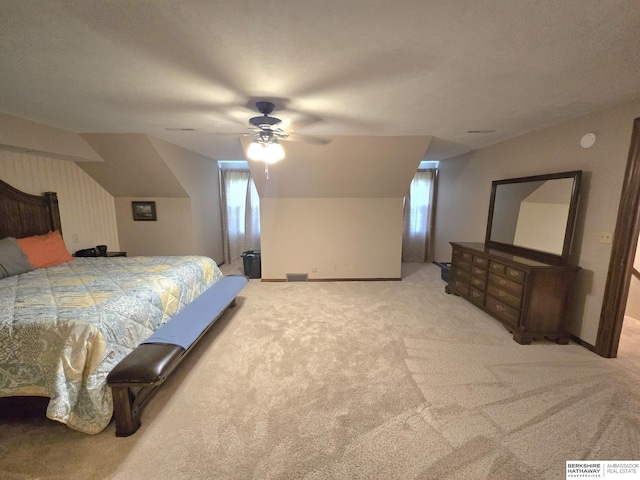 1924 W 8th Ave, Plattsmouth, NE 68048 - bedroom with light carpet, vaulted ceiling, a ceiling fan, and baseboards