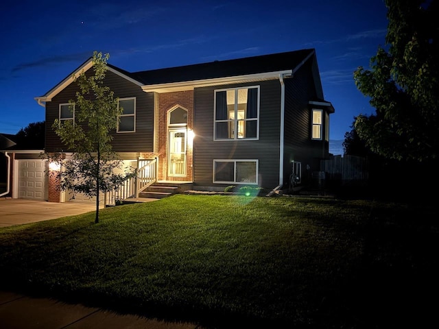 2110 Herel St, Lincoln, NE 68512 - raised ranch featuring a front lawn and driveway