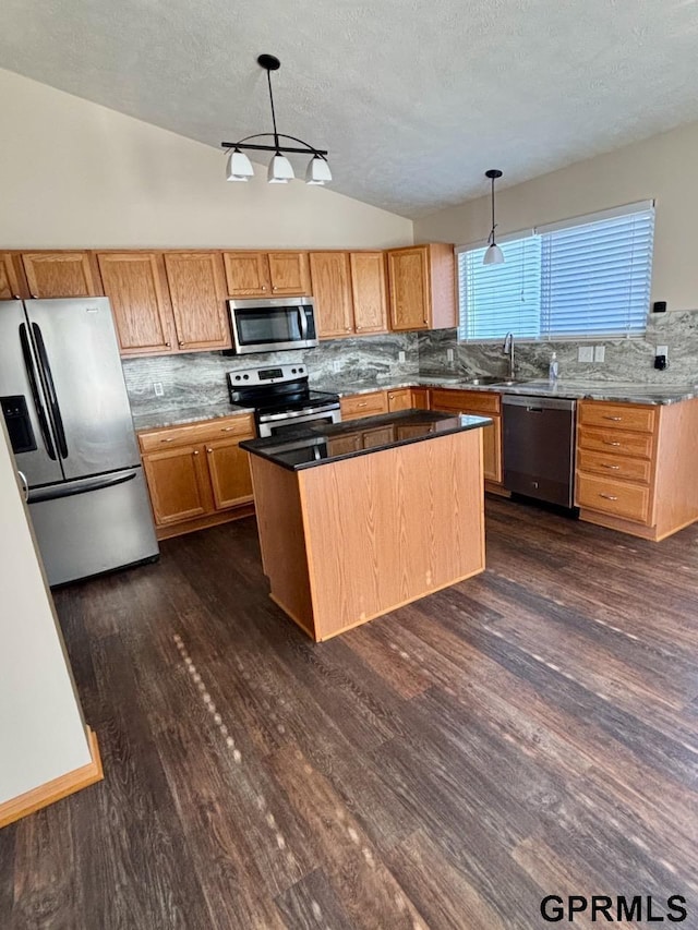 2110 Herel St, Lincoln, NE 68512 - kitchen featuring stainless steel appliances, tasteful backsplash, dark wood-style floors, a textured ceiling, and lofted ceiling