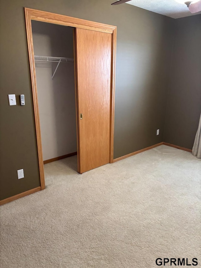 2110 Herel St, Lincoln, NE 68512 - unfurnished bedroom with a closet, carpet flooring, and baseboards