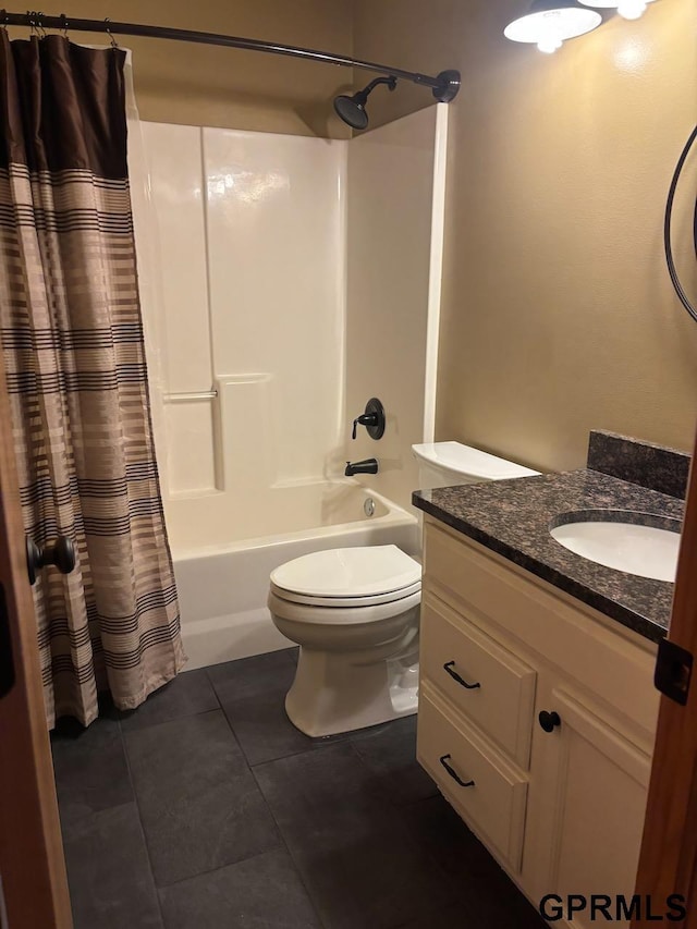 2110 Herel St, Lincoln, NE 68512 - bathroom featuring shower / tub combo, vanity, tile patterned flooring, and toilet