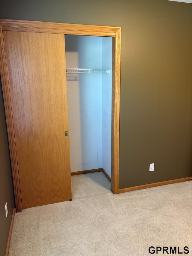 2110 Herel St, Lincoln, NE 68512 - unfurnished bedroom featuring carpet, a closet, and baseboards