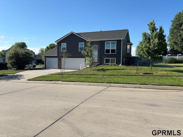 2110 Herel St, Lincoln, NE 68512 - traditional home featuring concrete driveway and an attached garage