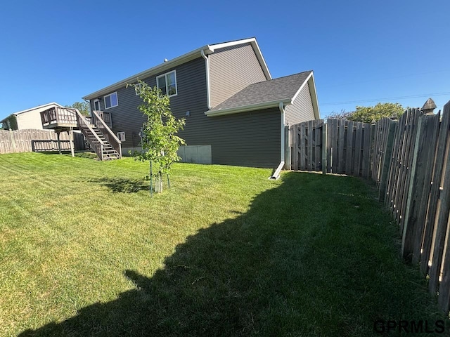2110 Herel St, Lincoln, NE 68512 - view of yard featuring stairway and a wooden deck