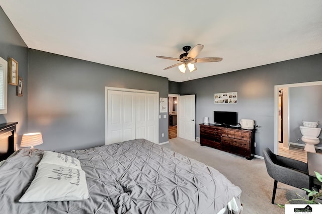 1946 Eastgate Dr, Crete, NE 68333 - bedroom with light carpet, a closet, baseboards, and a ceiling fan
