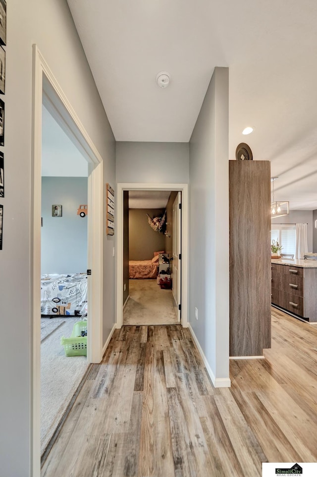 1946 Eastgate Dr, Crete, NE 68333 - hallway featuring light wood-style floors and baseboards